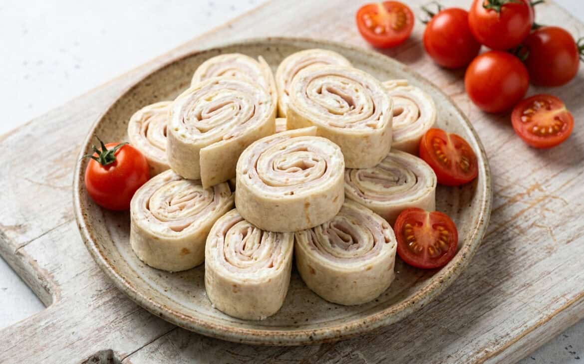 A plate of turkey and cream cheese tortilla pinwheels